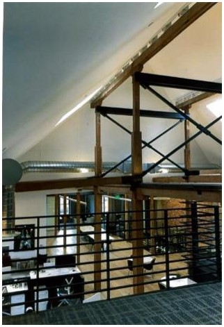 After: view of gable roof space and minimal structural reinforcement after rehabilitation